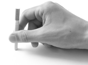 Cigarette in a hand.