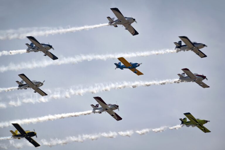 The Full Throttle Formation Team flying in formation with smoke trails