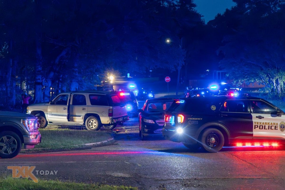 Police vehicles blocking a street during the Pine Street SWAT standoff.