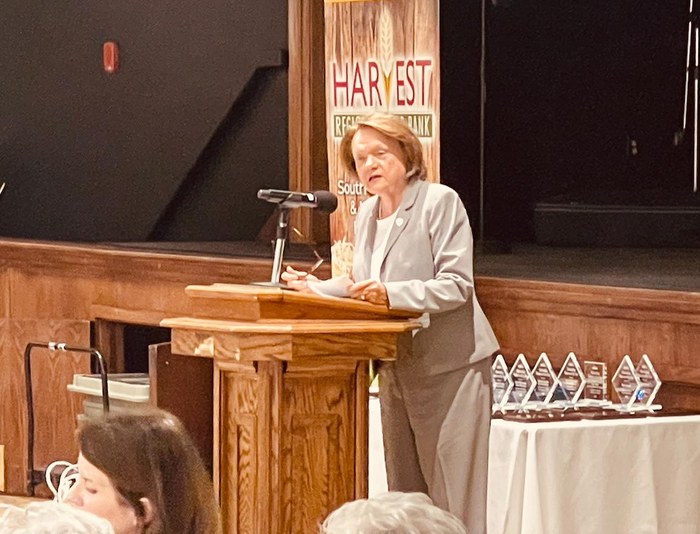 A speaker addresses the crowd at Harvest Regional Food Bank's Hunger Action Luncheon
