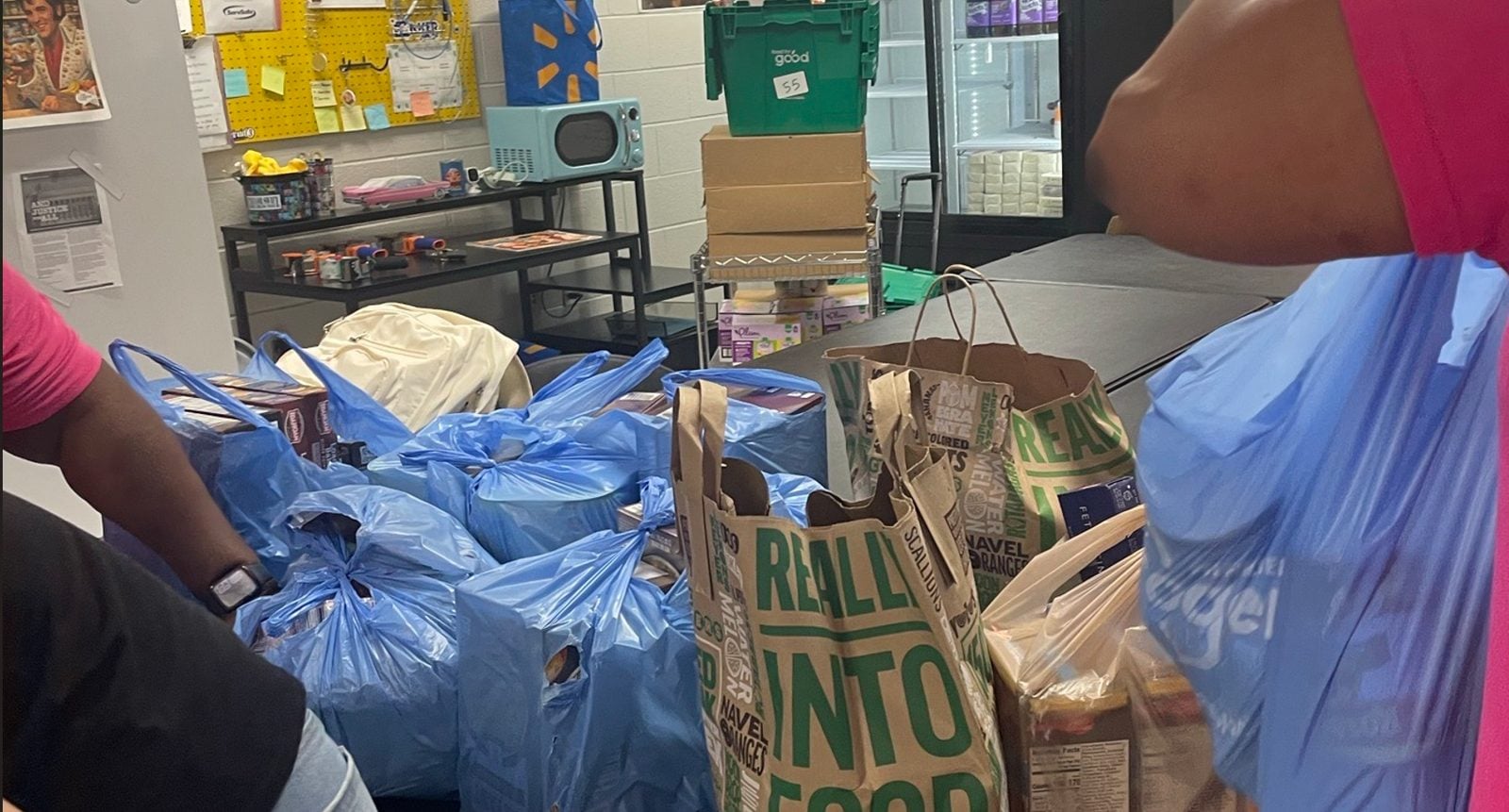 Blue and paper grocery bags filled with donations in the Pig Pantry. Submitted photo. Blue and paper grocery bags filled with donations in the Pig Pantry