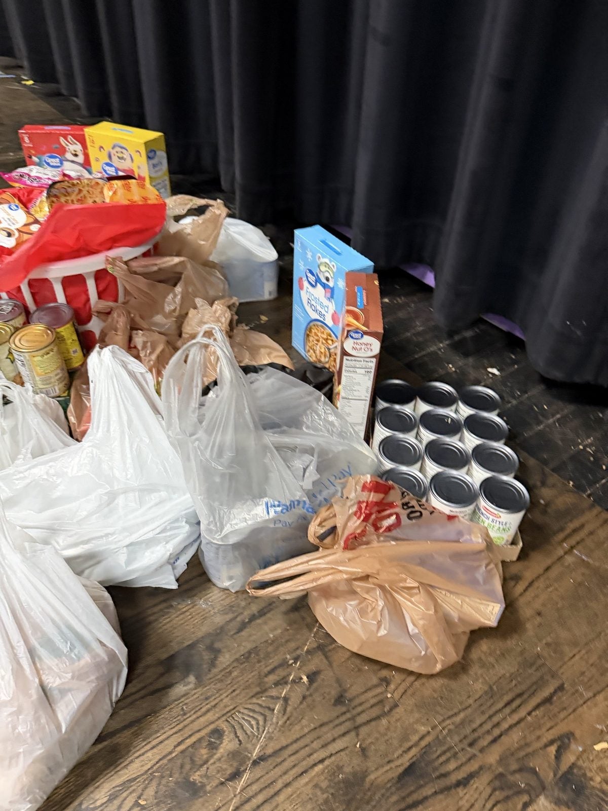 Bags of groceries and canned vegetables donated to the Pig Pantry. Submitted photo. Bags of groceries and canned vegetables donated to the Pig Pantry