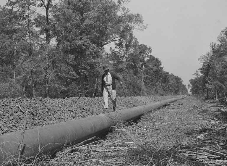 Mike Miles, chief inspector, walks the line between the state line and Gurdon. Photo: John Vachon, Office of War Information, Library of Congress. Chief inspector Mike Miles walking the Big Inch pipeline, 1942