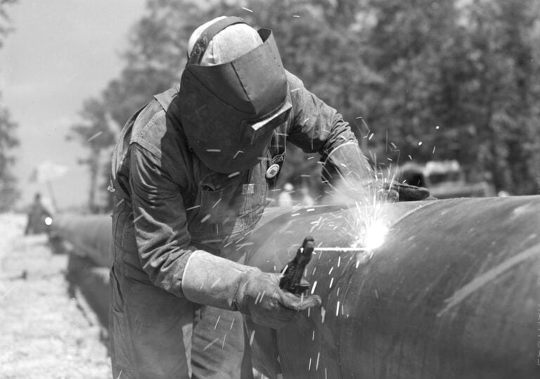 An electric welder at work between the state line and Gurdon. Photo: John Vachon, Office of War Information, Library of Congress. Electric welder at work on the Big Inch, 1942