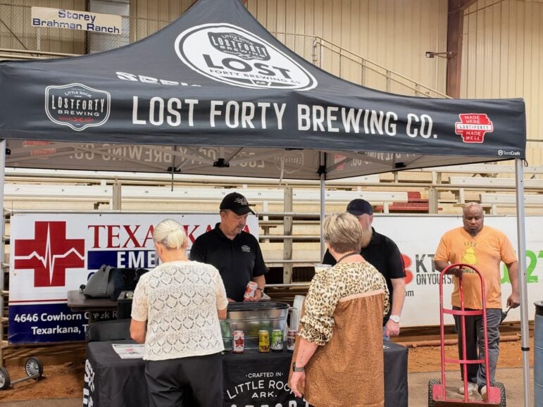 Lost Forty Brewing tent with staff serving guests