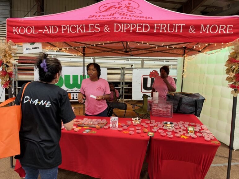 Swell Sweets pink tent advertising Kool-Aid pickles and dipped fruit